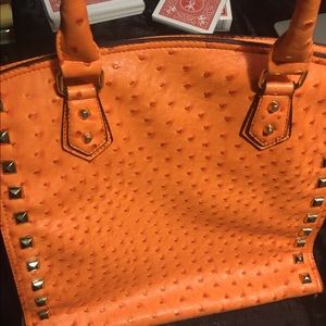Orange faux ostrich skin pleather purse